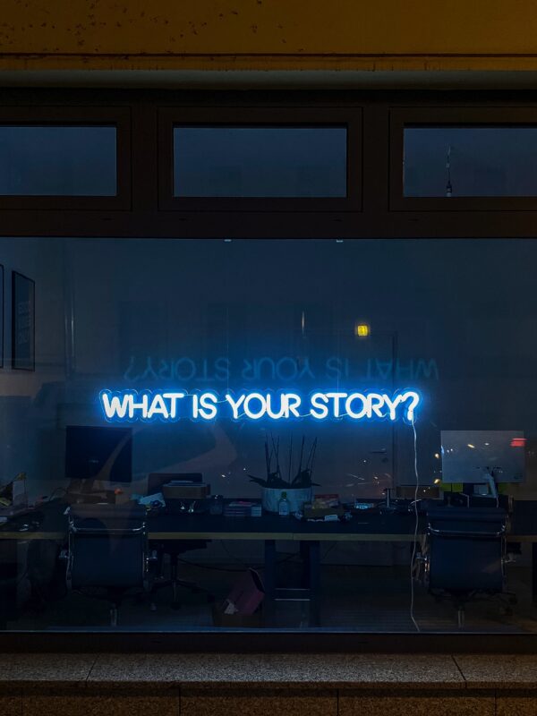 a sign that says "what's your story"