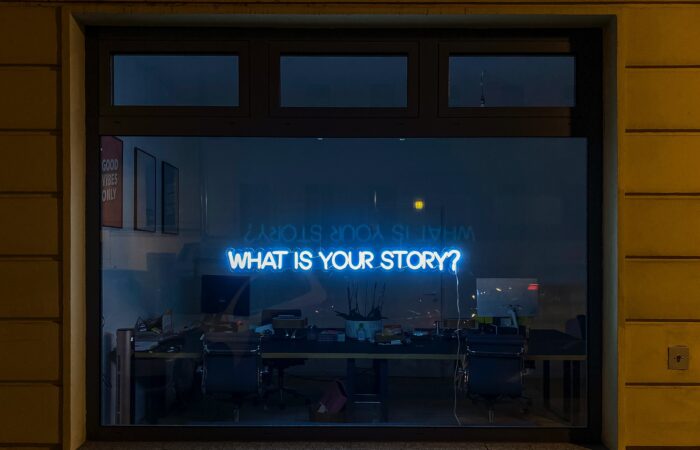 a sign that says "what's your story"