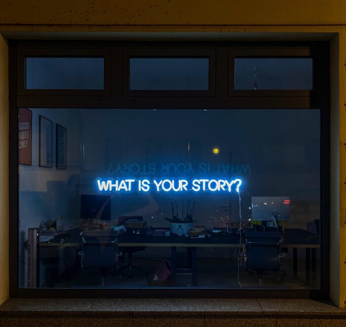 a sign that says "what's your story"