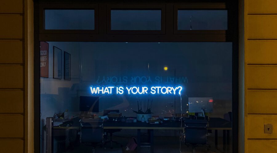 a sign that says "what's your story"