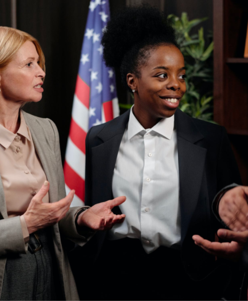 A group of paralegals talk and communicate during a meeting