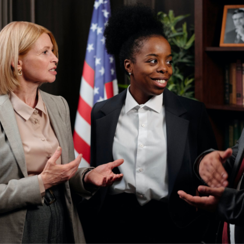 A group of paralegals talk and communicate during a meeting