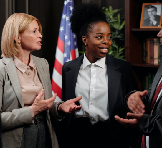 A group of paralegals talk and communicate during a meeting