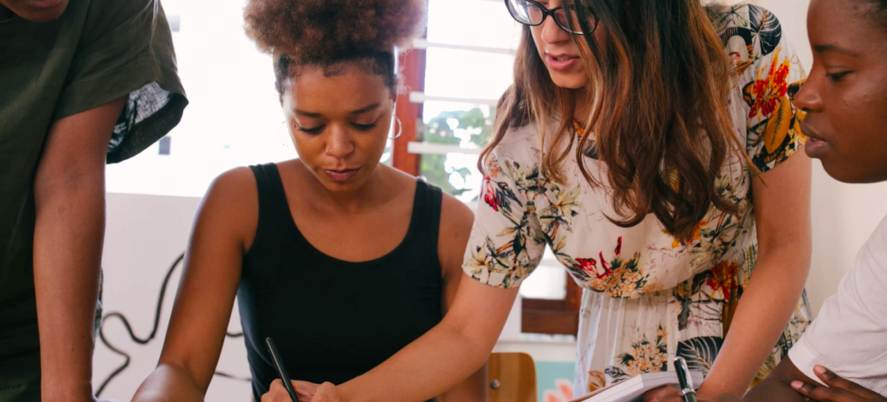 A business owner guides her team members