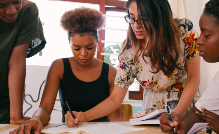 A business owner guides her team members