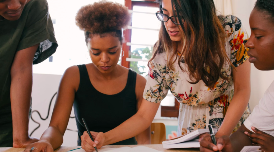 A business owner guides her team members