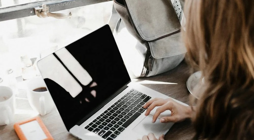 A professional grant writer works at her desk