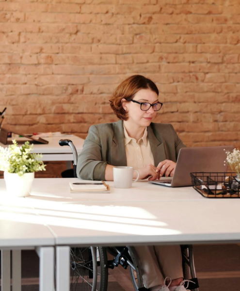 A grant writer works at her desk