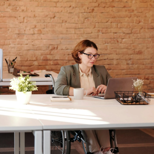 A grant writer works at her desk