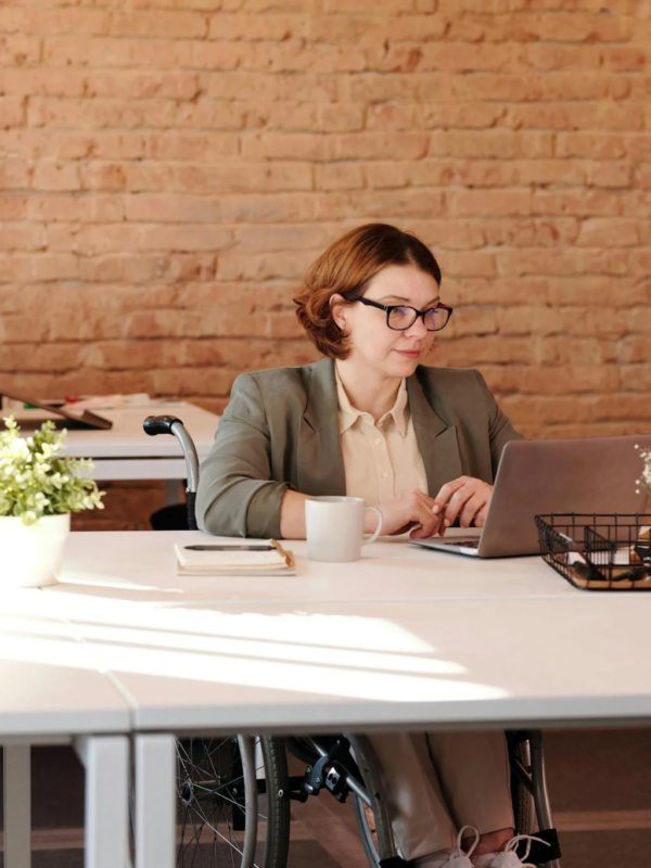 A grant writer works at her desk