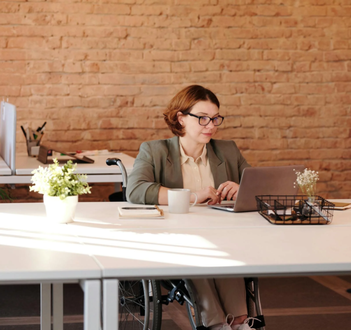 A grant writer works at her desk