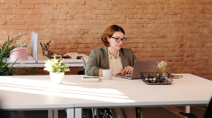 A grant writer works at her desk