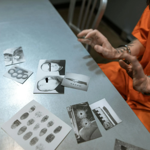 A prisoner reviews evidence in jail