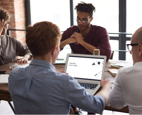 A group of people sitting and working together