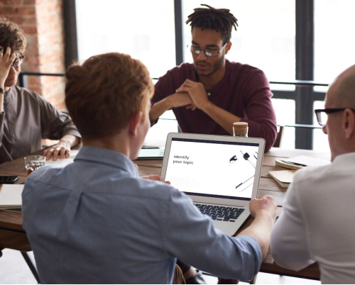 A group of people sitting and working together