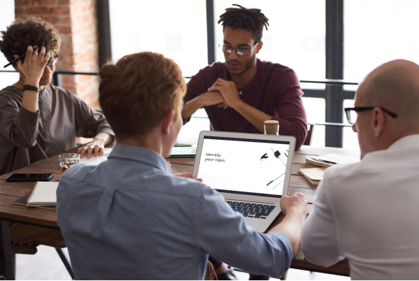 A group of people sitting and working together