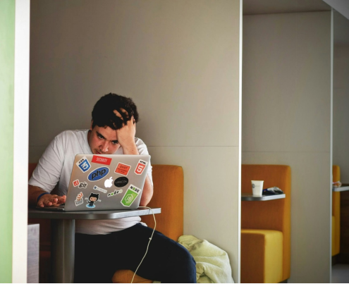 a man sitting in a café and studying