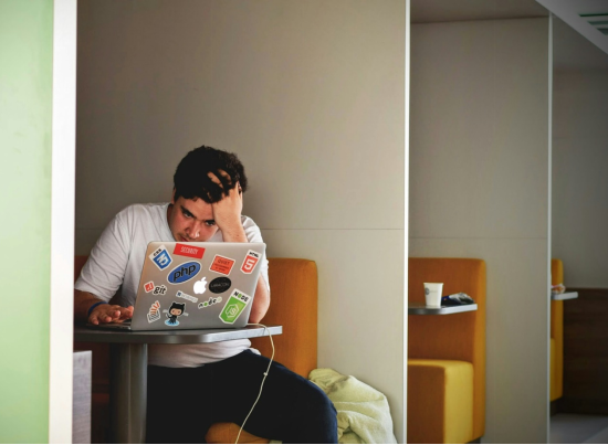 a man sitting in a café and studying