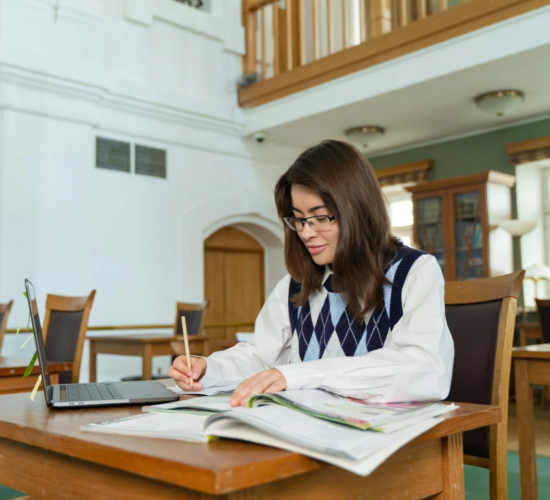 A grant writer makes a plan, writing.