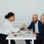 A mediation expert discusses details with clients