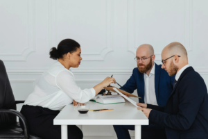 A mediation expert discusses details with clients