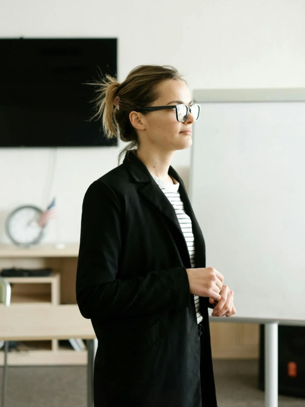 A motivational speaker addresses a room