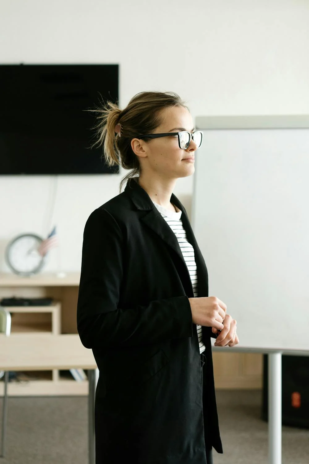 A motivational speaker addresses a room