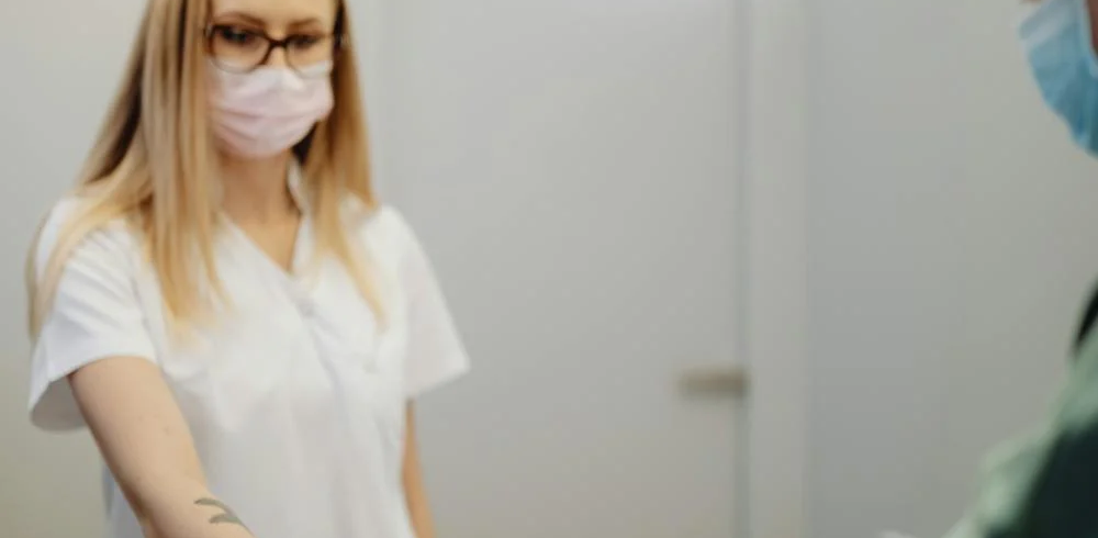 A patient pays at a reception