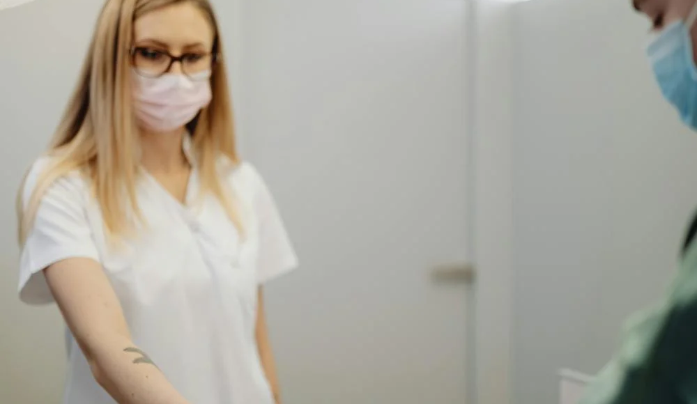 A patient pays at a reception