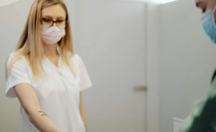 A patient pays at a reception