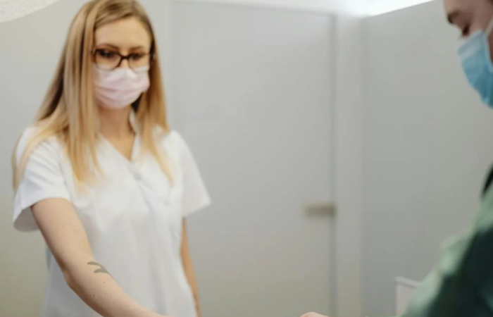 A patient pays at a reception