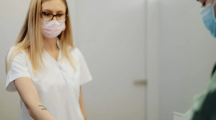 A patient pays at a reception